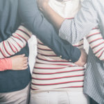 Group of youth holding each other by the waist