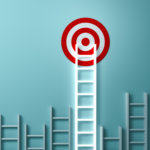 Many white ladders of different lengths. The longest ladder is reaching a target on the wall