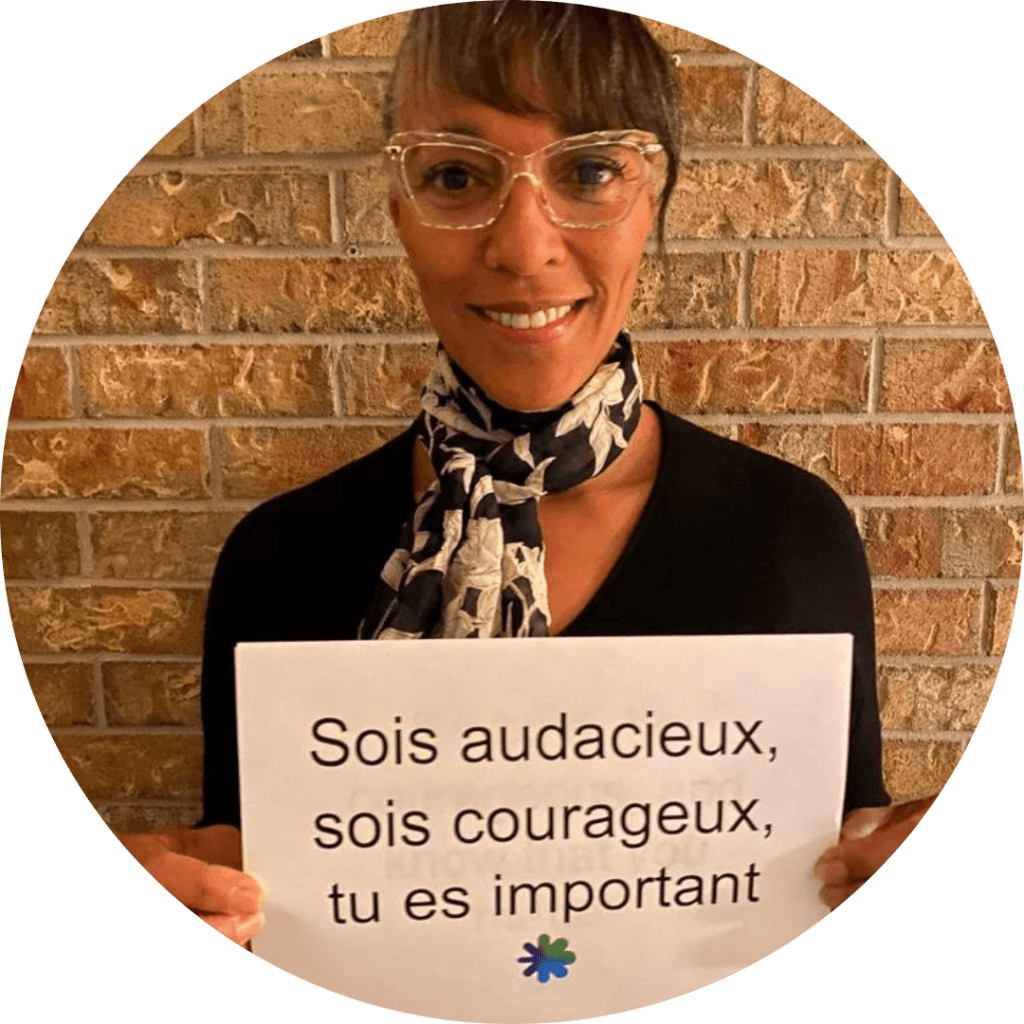 Patricia holding a sign - Be bold, be courageous, and know that you matter